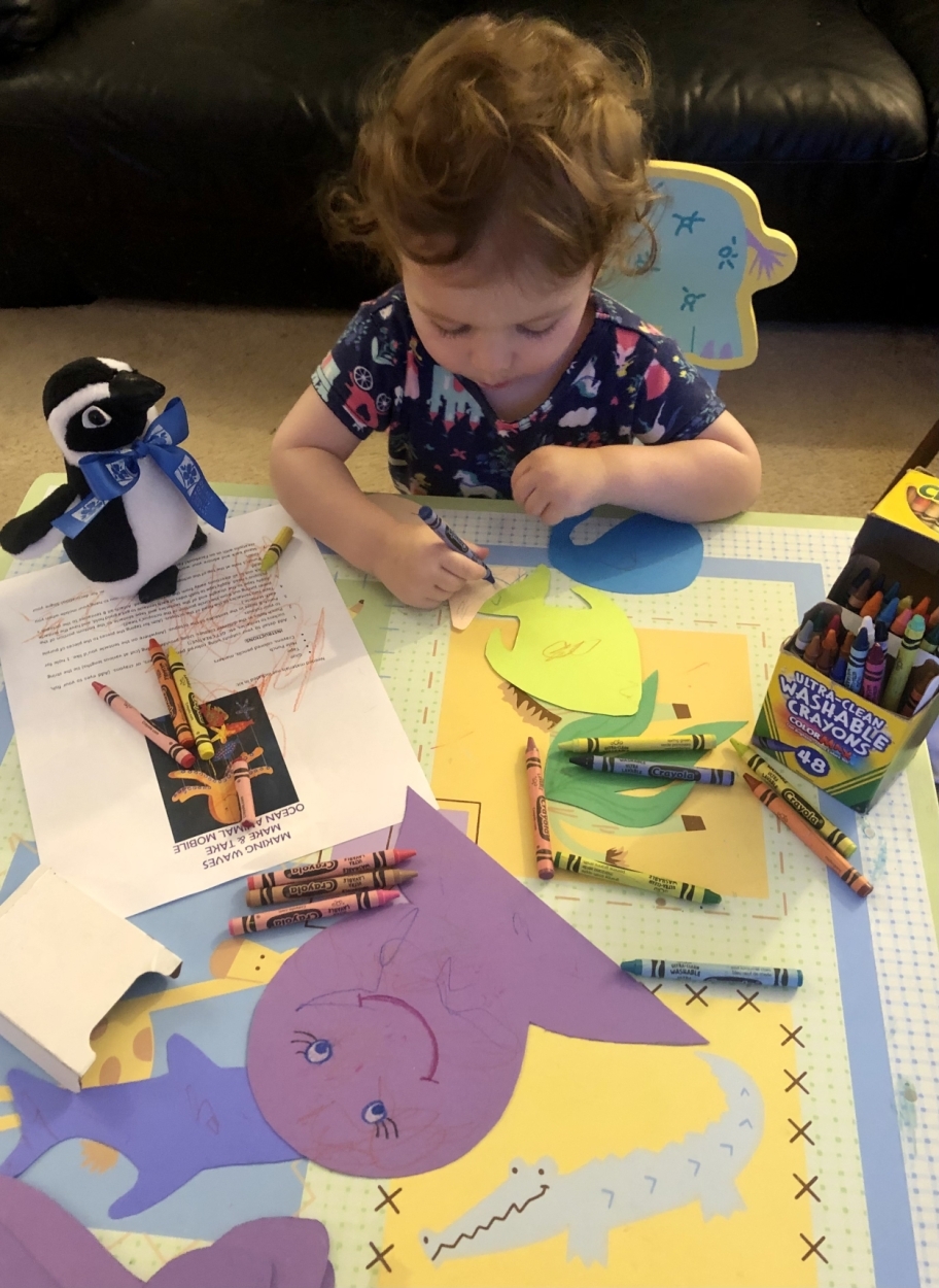 Charlie shared her photo of how she and Pengie spent a rainy day - doing a craft from the Doraville branch!